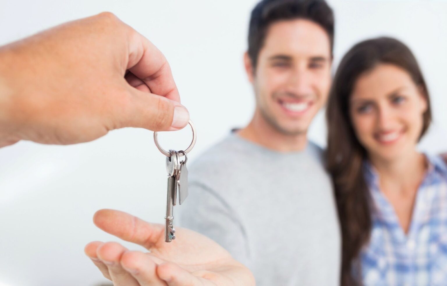 Couple Being Handed New House Key