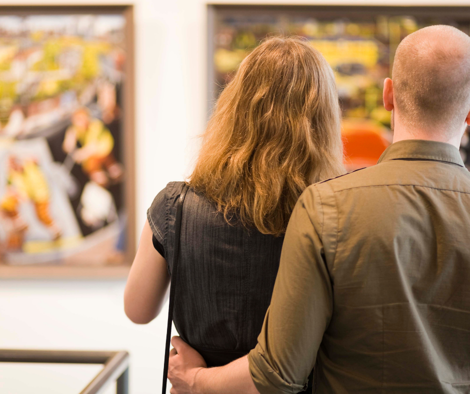 Couple enjoying art gallery. 