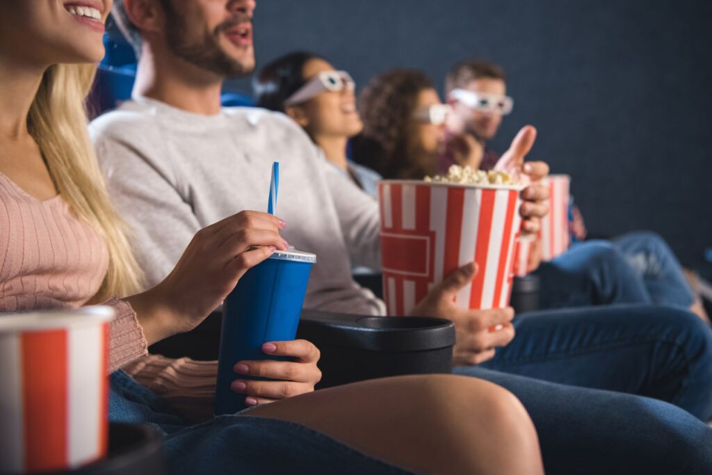 a group of people enjoying a film at one of the best movie theaters in Charleston
