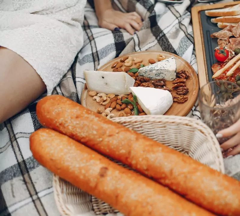 friends sitting in a garden on a picnic