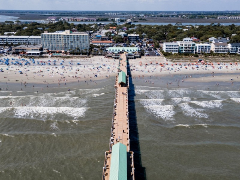 Things to Do in Folly Beach: A an aerial view of the iconic Folly Beach Pier.