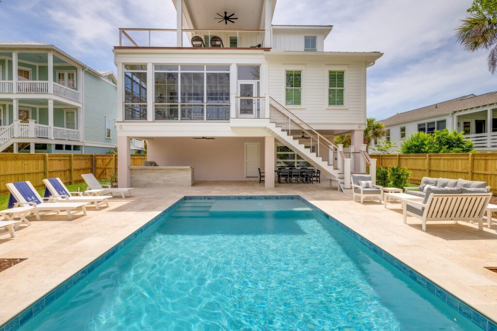 An exterior poolside view of an Isle of Palms vacation rental.